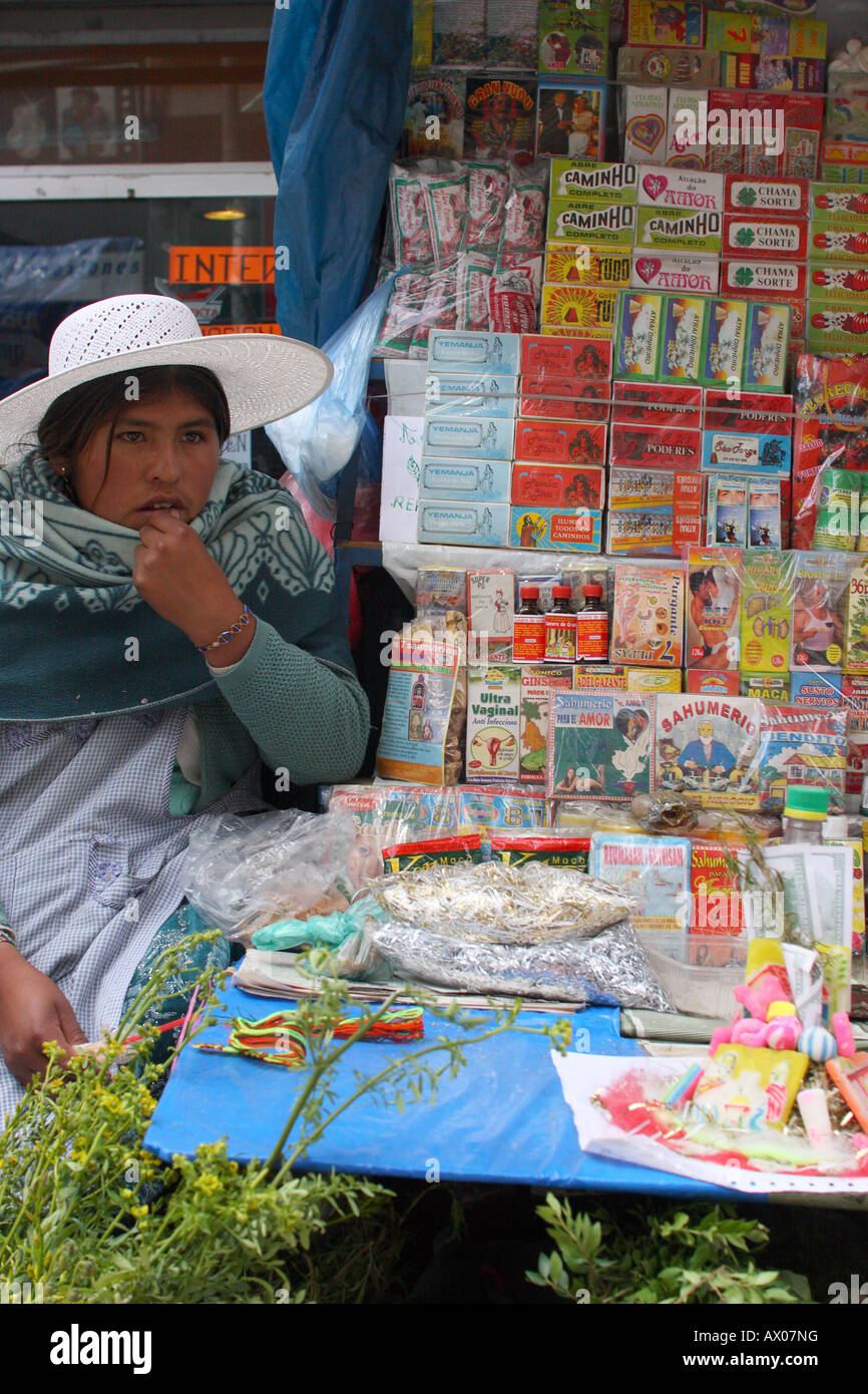An Aymara woman sells herbs and traditional remedies in the Witches' Market district of La Paz, Bolivia. Stock Photo