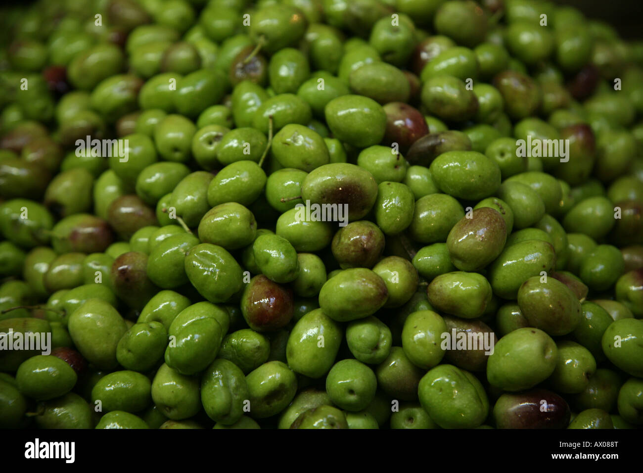 Closeup of green olives at a market in the old city section of Jerusalem Stock Photo