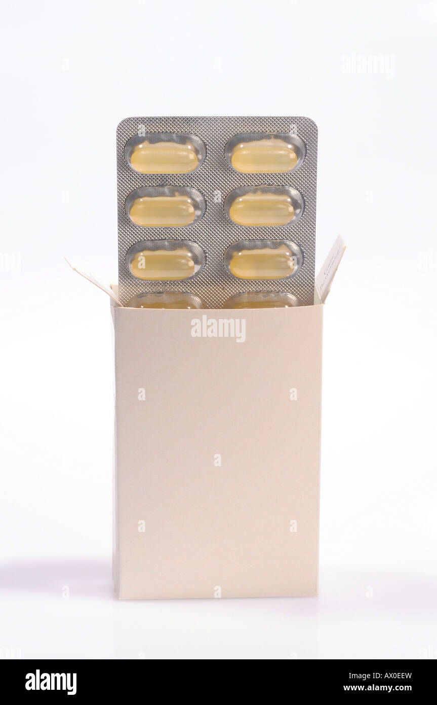 Pills in a neutral blister pack and unmarked package Stock Photo