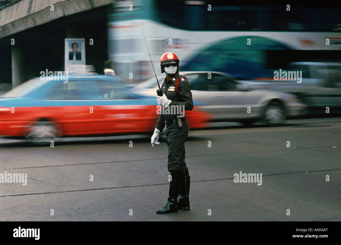 Traffic officer wearing dust respirator, Bangkok, Thailand, Asia Stock Photo