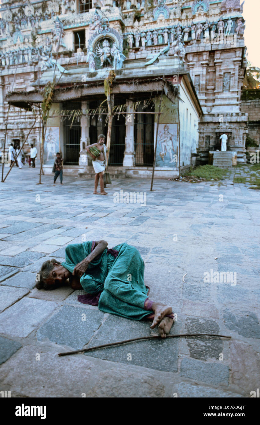 Homeless old Indian woman sleeping in temple complex, Karnataka, India, Asia Stock Photo