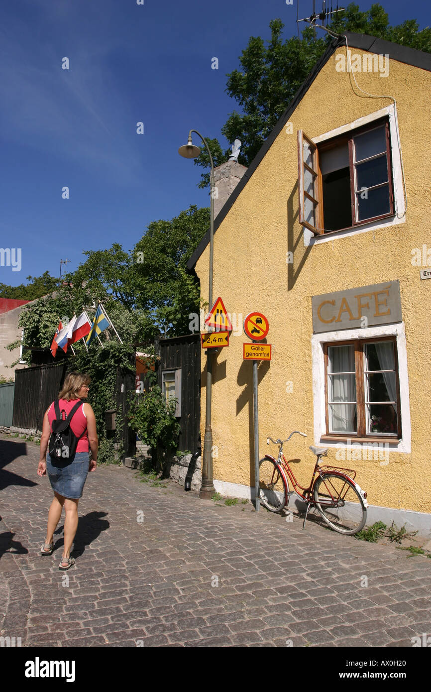 Female tourist outside a café in Visby, Gotland, Sweden Stock Photo