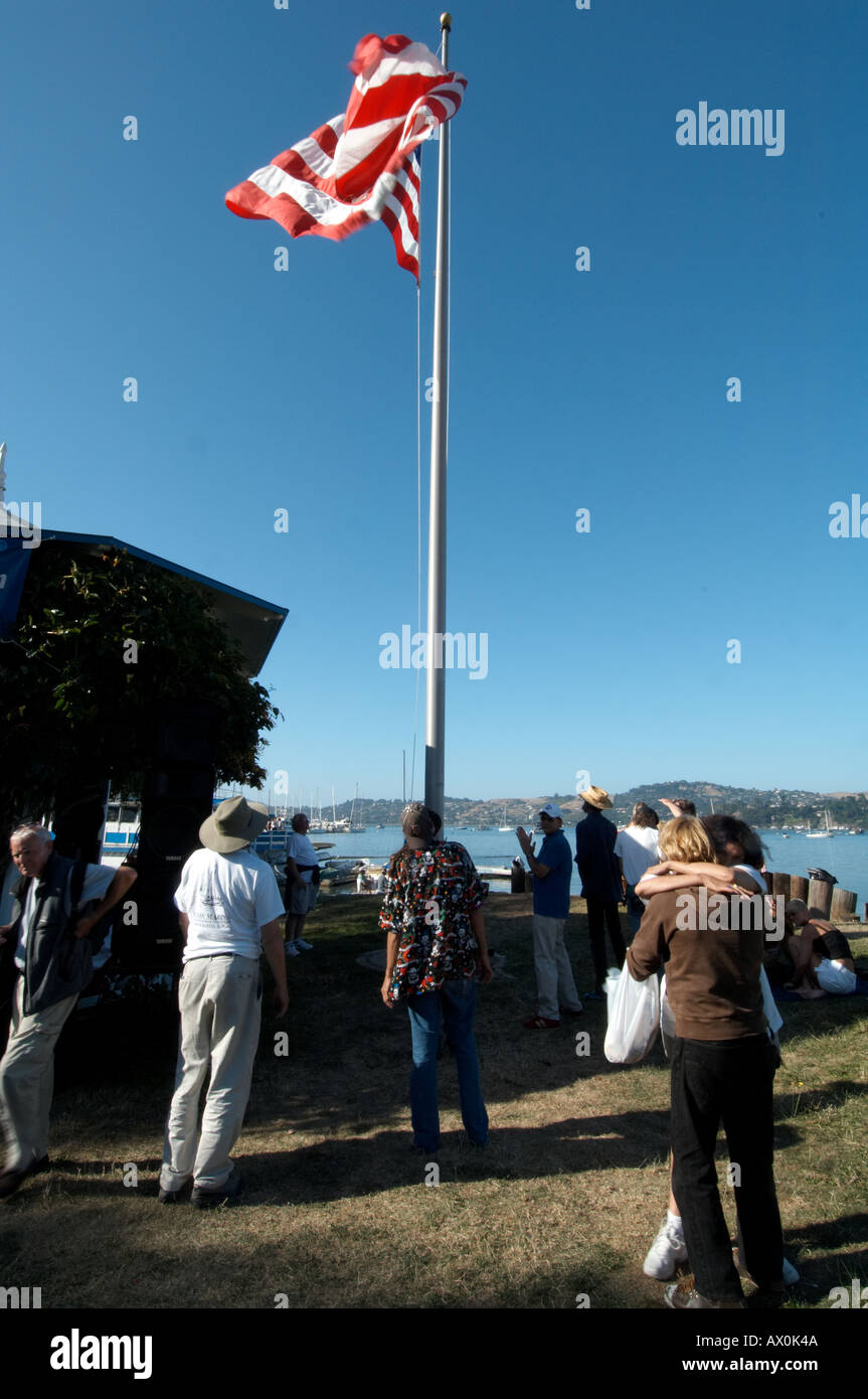 preparing to lower the American flag at the end of day on the 4th of July in Sausalito,California,USA Stock Photo
