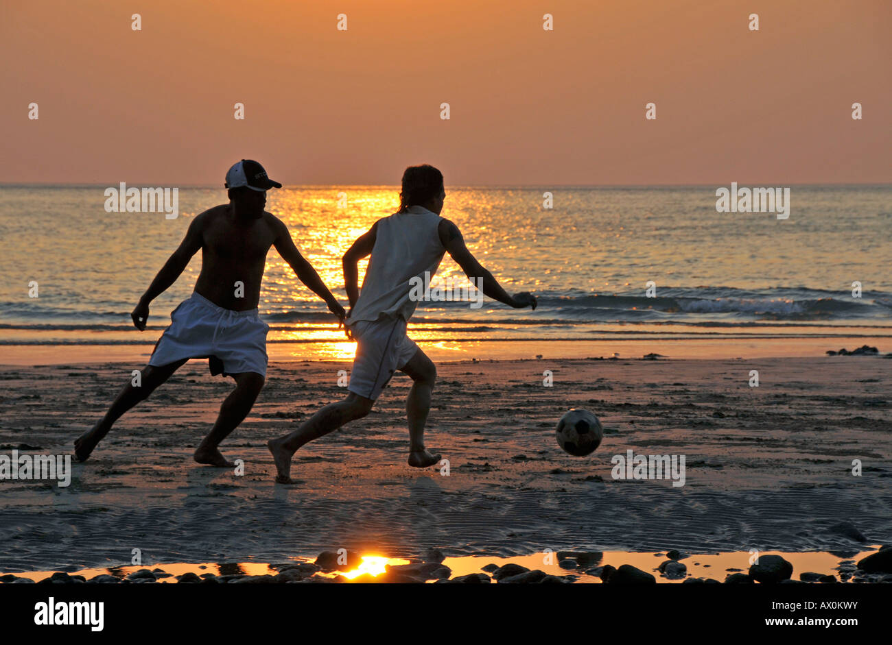 Playing football (soccer) on the beach, Koh Chang, Thailand, Southeast Asia, Asia Stock Photo