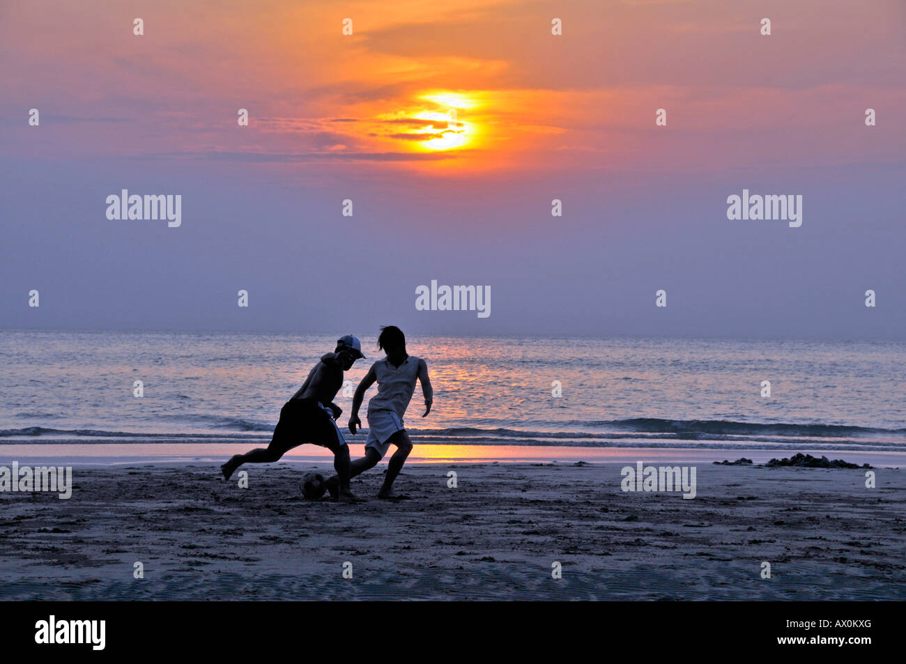 Playing football (soccer) on the beach, Koh Chang, Thailand, Southeast Asia, Asia Stock Photo