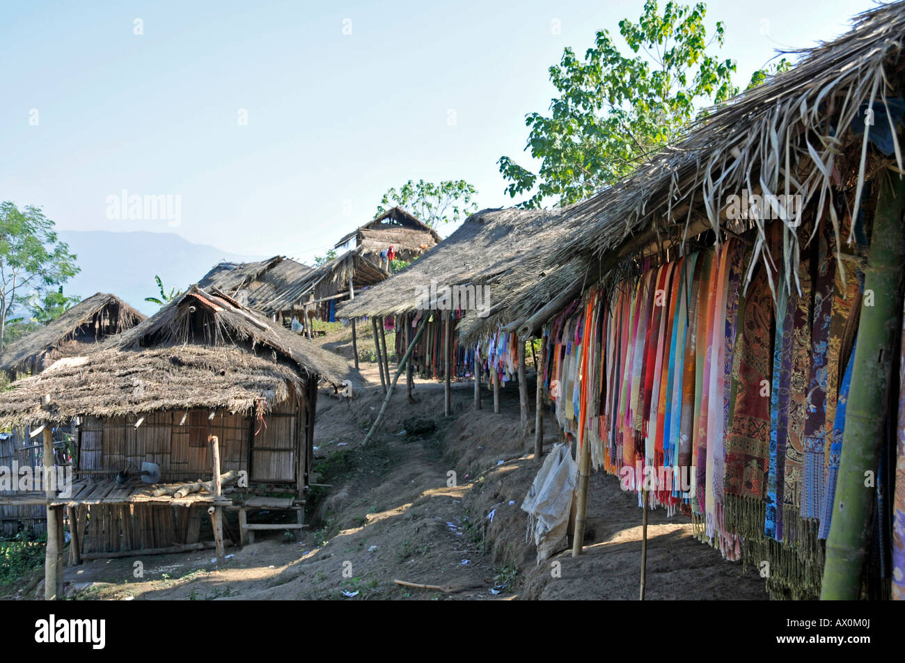 Padaung or Kayan ethnic minority living as refugees in stilt houses along the Myanmar-Thailand border, Southeast Asia, Asia Stock Photo