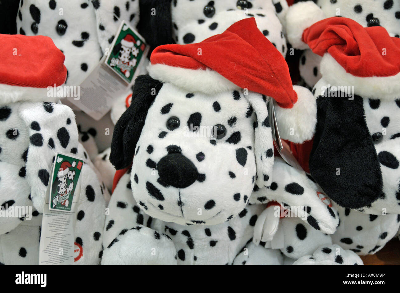 Stuffed dalmatians wearing Santa hats for sale at Sheikh Rashid Terminal, Dubai International Airport, Dubai, United Arab Emira Stock Photo