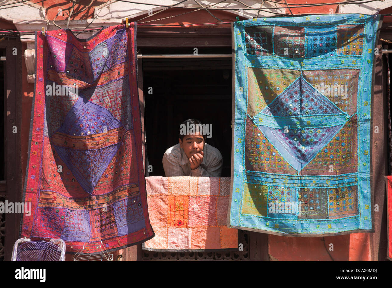 Nepal, Kathmandu, Man peers out of window of souviner shop Stock Photo