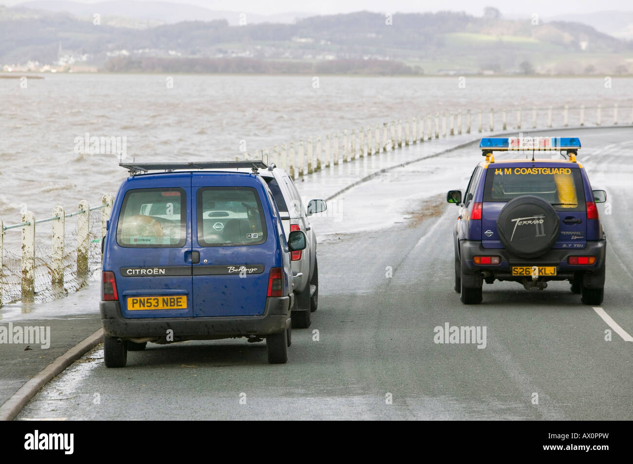 Flooding at Sandside near Arnside UK caused by high spring tides and gale force winds pushing the sea over onto the land Stock Photo