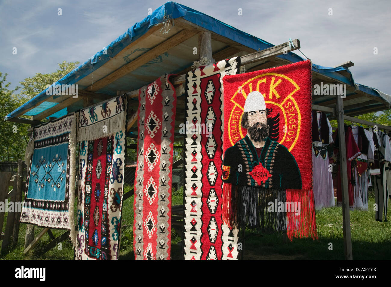 Serbia, Kosovo, Pec, Roadside Souvenir stall selling rugs with UCK (Kosovo Liberation Army) Artwork. Stock Photo