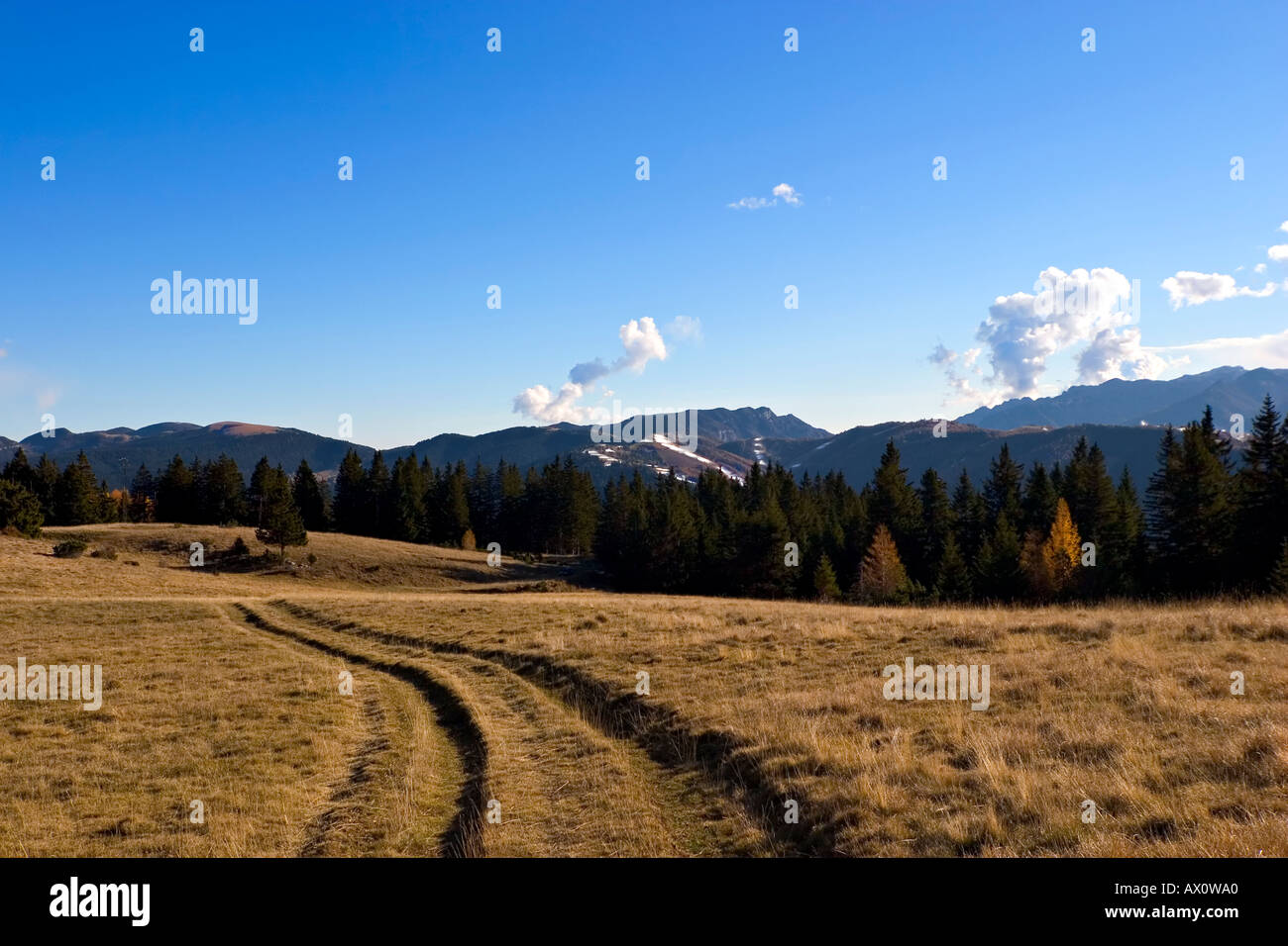 Colors of the autumn High mountain with background tracks from ski Sky and clouds Stock Photo