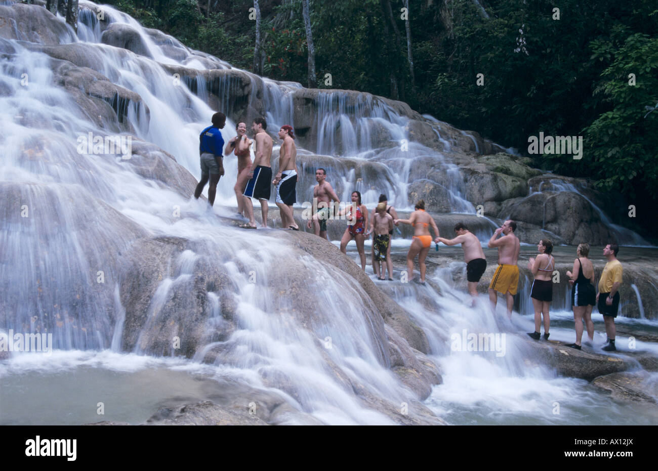 Tourists forming human chain Dunn's River Falls Ocho Rios Jamaica January 2005 Stock Photo