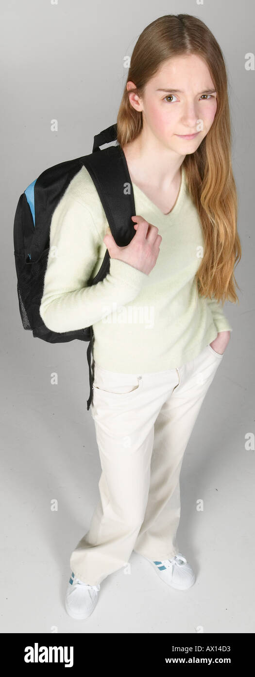 Skeptical teenaged girl carrying backpack Stock Photo - Alamy