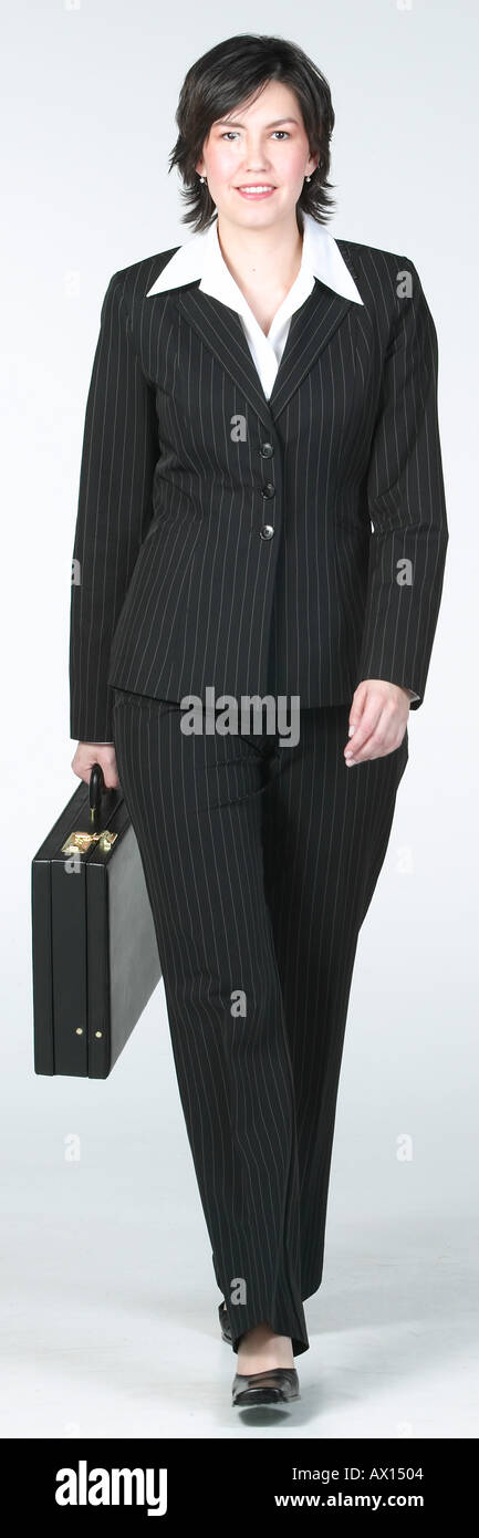 Black woman walking in suit hi-res stock photography and images - Alamy