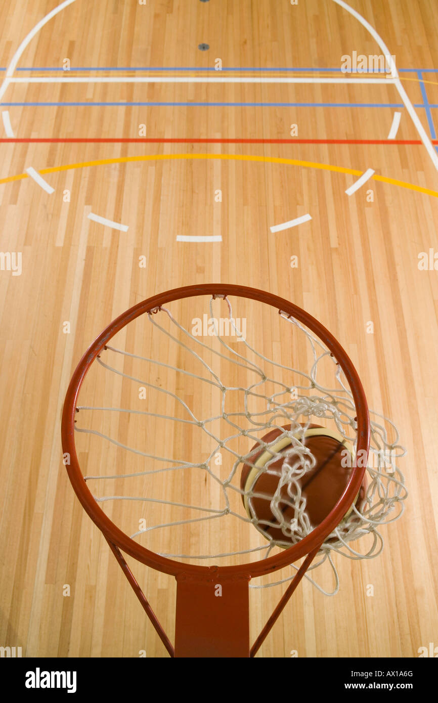 A basket being made by a basketball Stock Photo