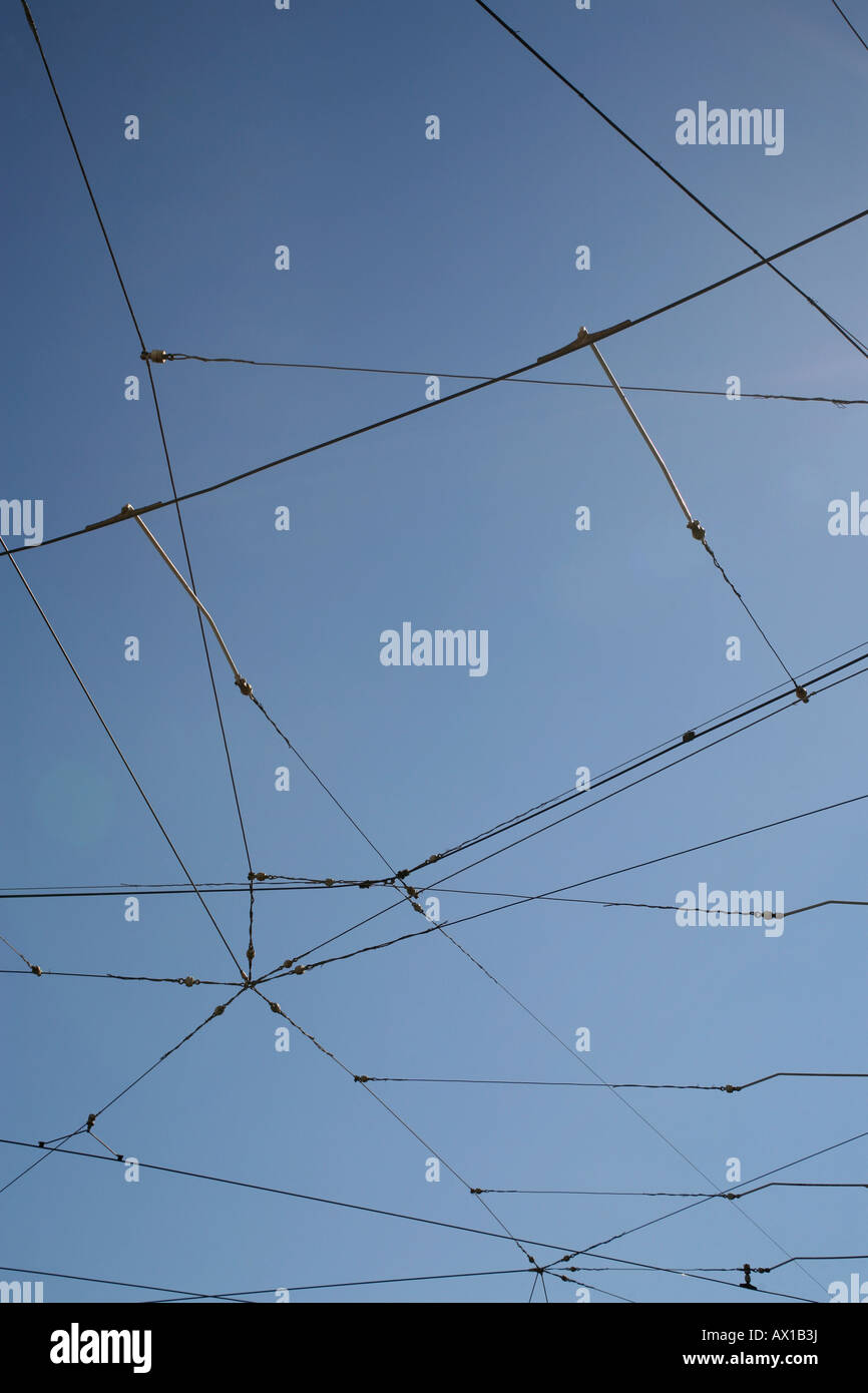 Power lines against a blue sky Stock Photo - Alamy