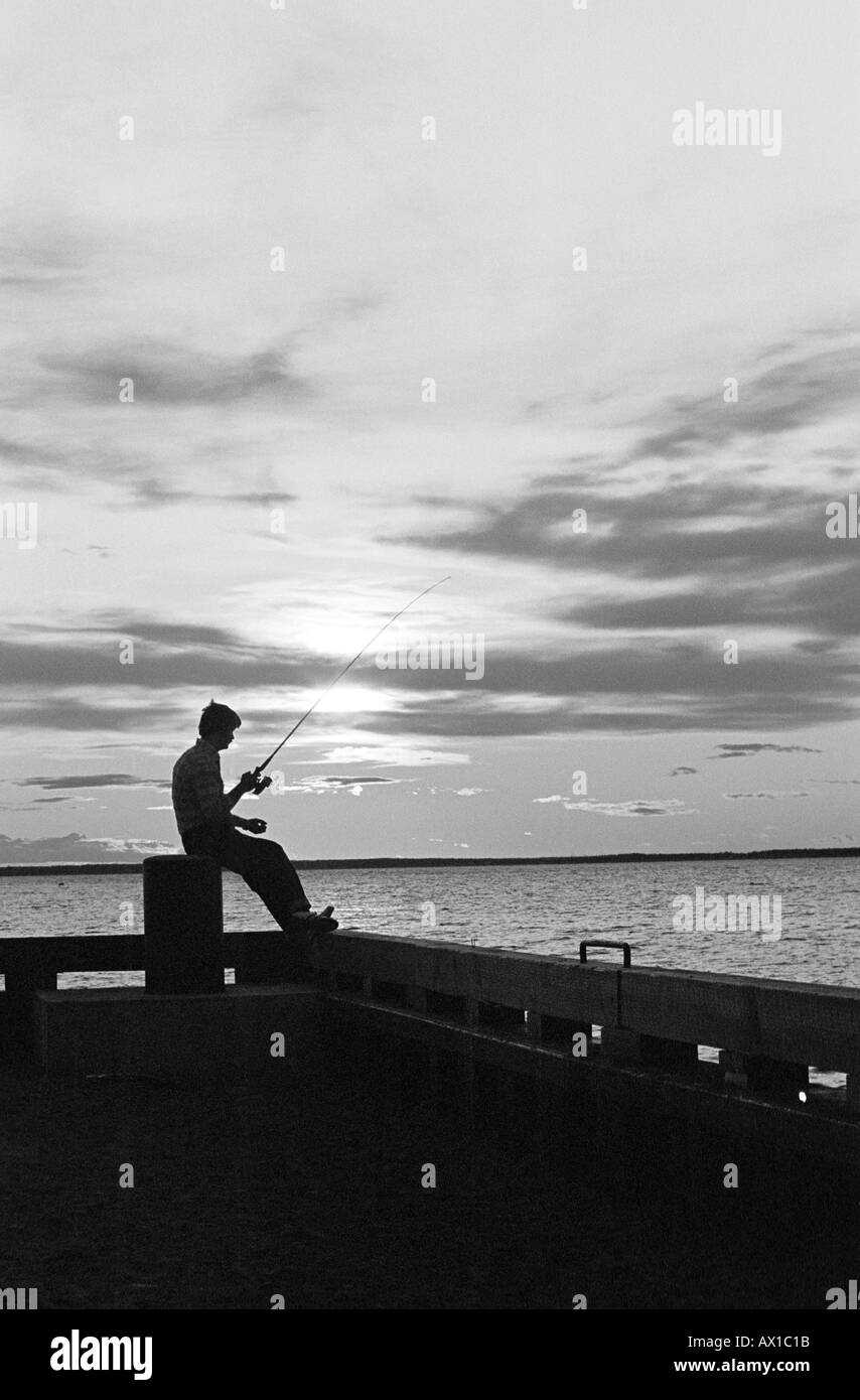 Man fishing with rod Black and White Stock Photos & Images - Alamy