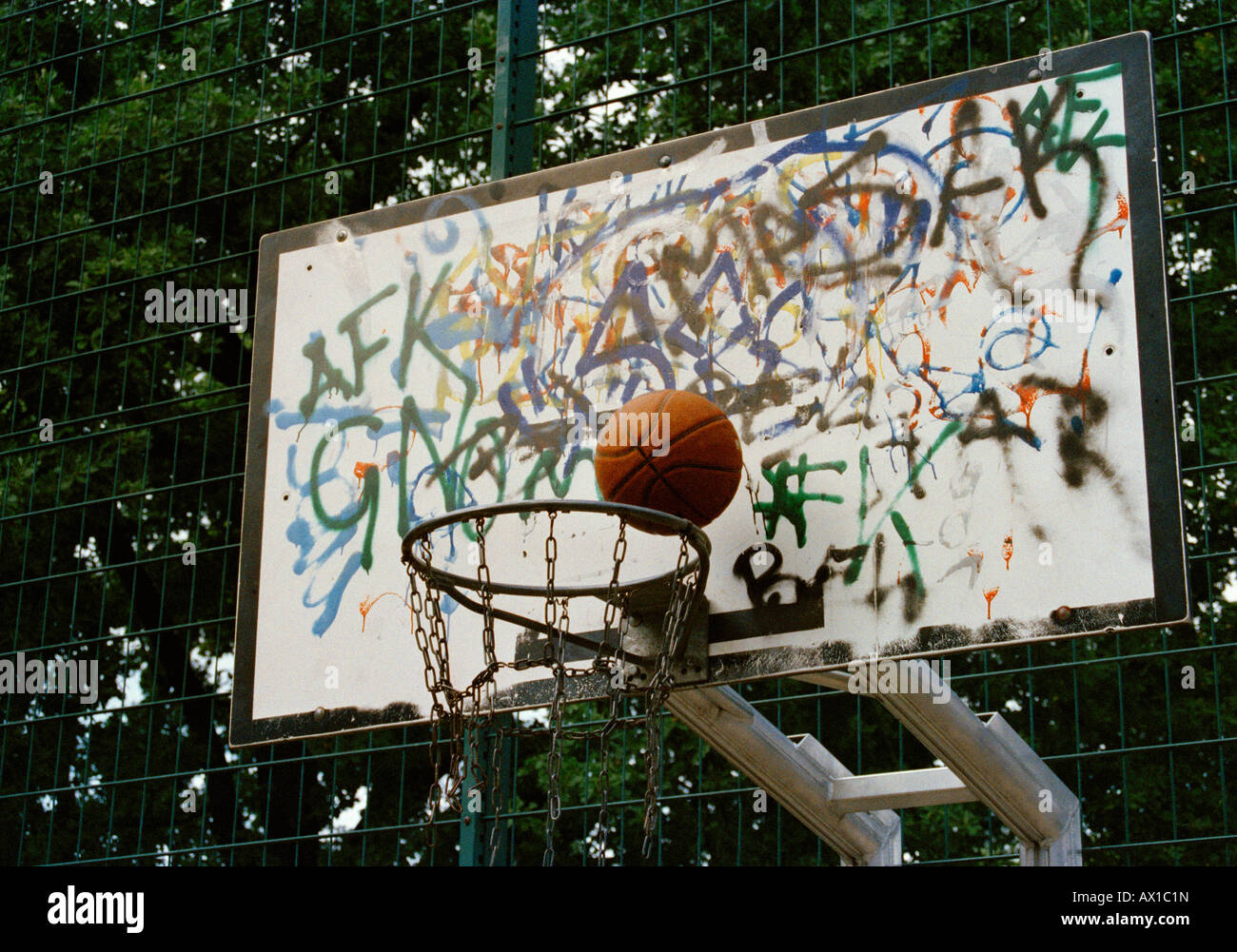 Basketball going into a basketball hoop Stock Photo Alamy