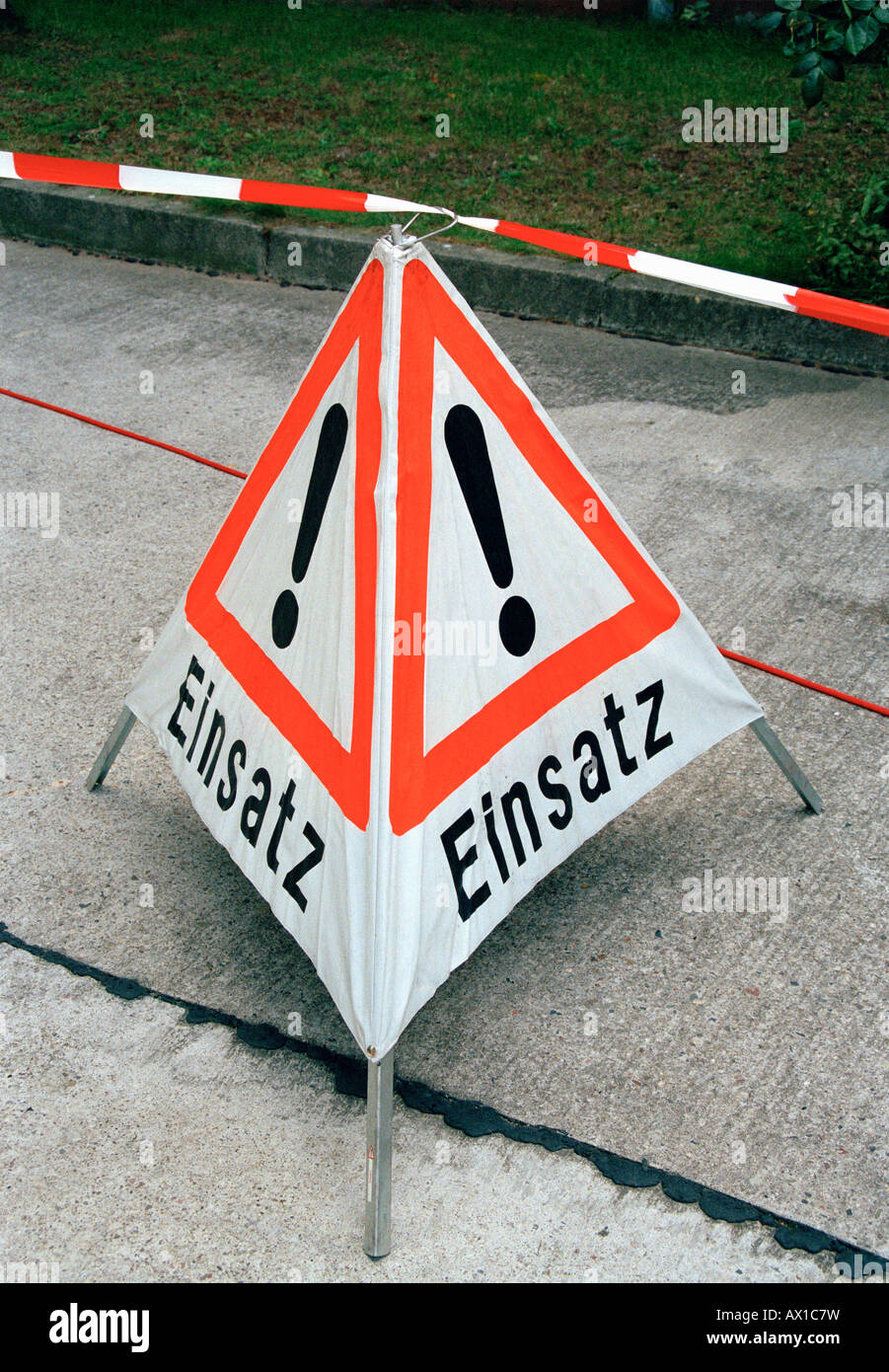 German warning sign used to alert people help is on the way Stock Photo