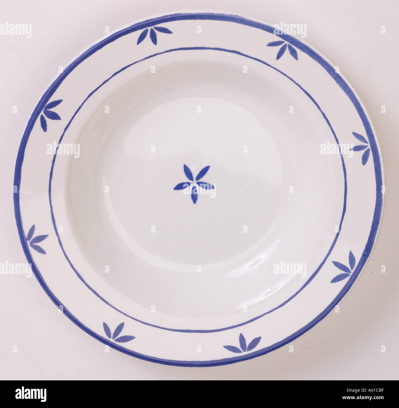 White china bowl with blue leaf pattern L1 Stock Photo