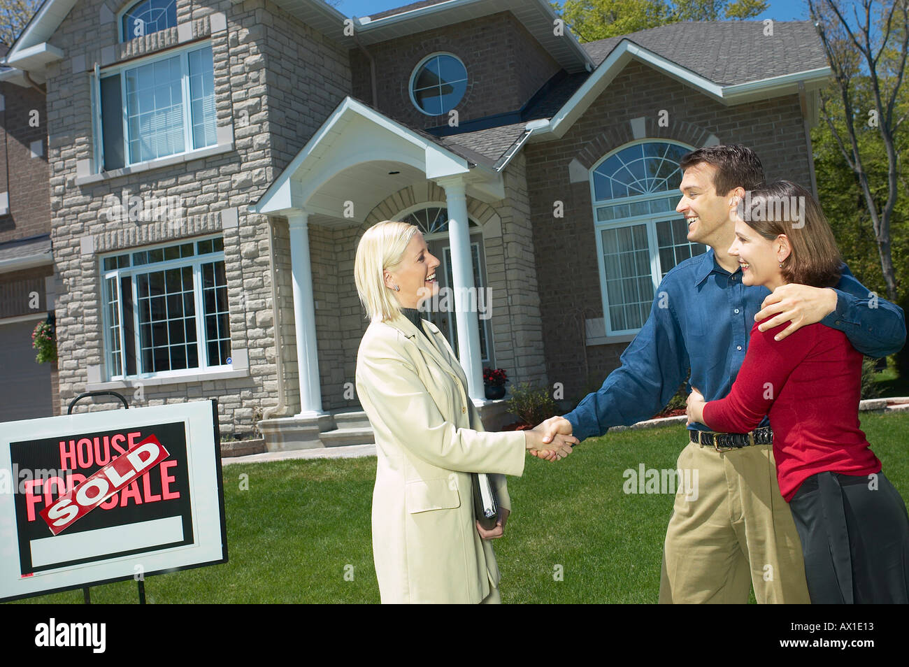 Real estate owner selling home to young couple 4 Stock Photo Alamy