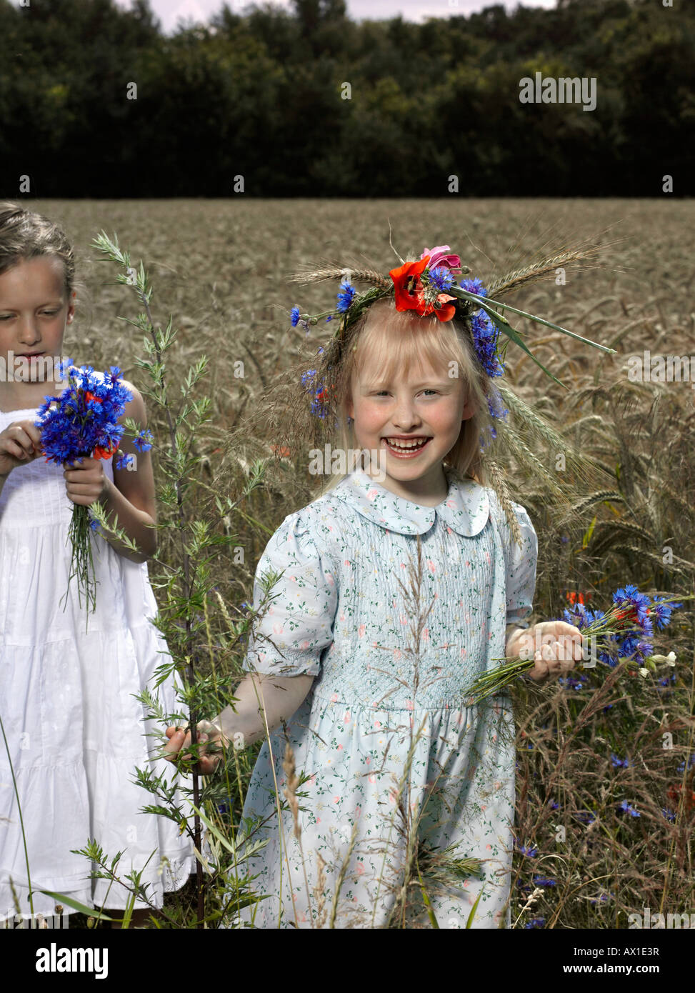 Children playing in field flowers hi-res stock photography and images ...