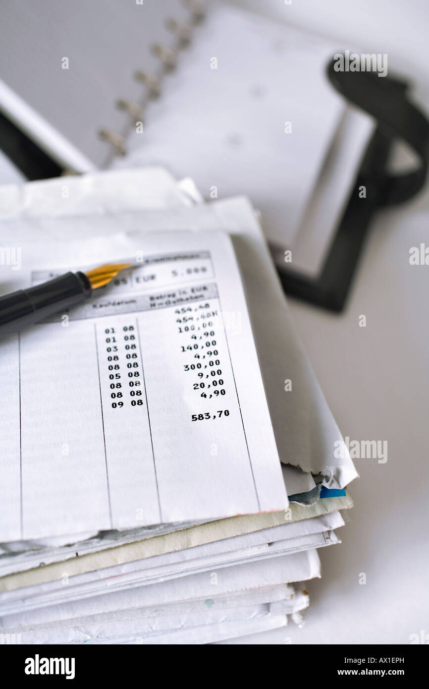 Stack of letters, bank statement, fountain pen and agenda book Stock Photo