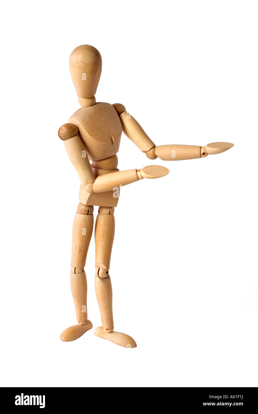 Wooden jointed mannequin gesturing as if presenting something, presentation, pointing Stock Photo
