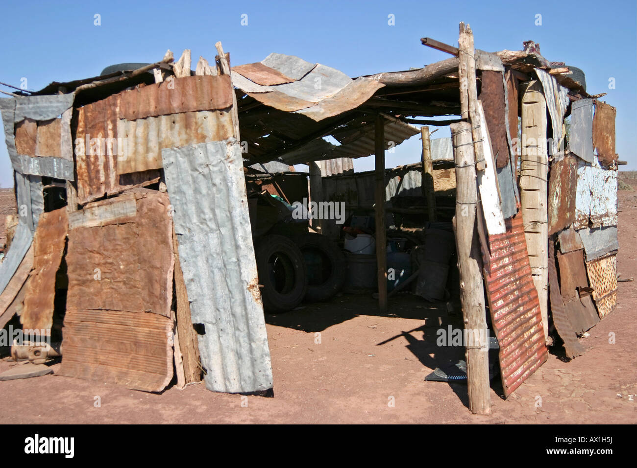 Small barrack consists of scrap metal, Namibia, Africa Stock Photo