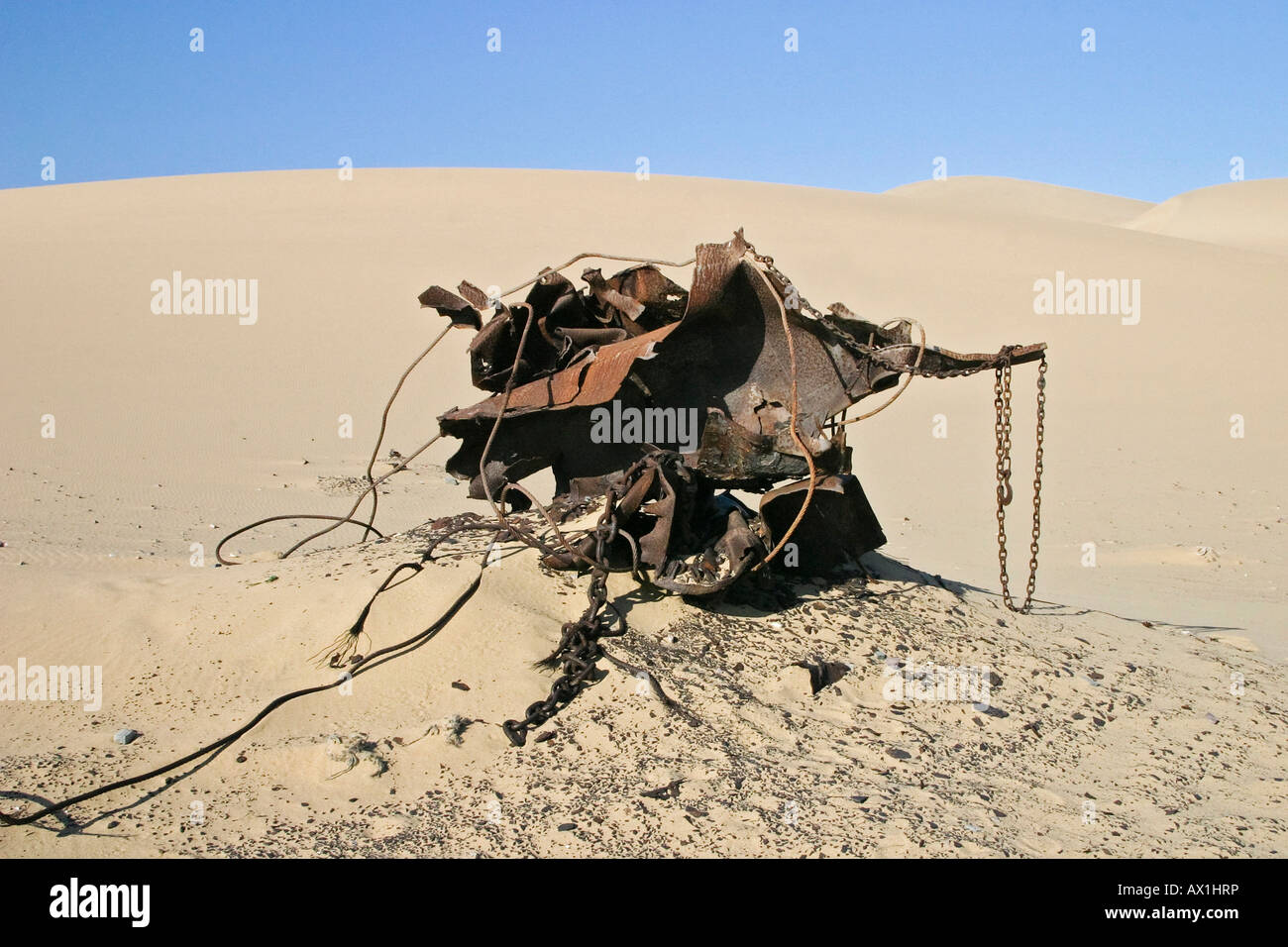 Old strong rusted engine parts from the detonated 'United Traider', diamond prohibited area, Saddlehill, Namibia, Africa Stock Photo