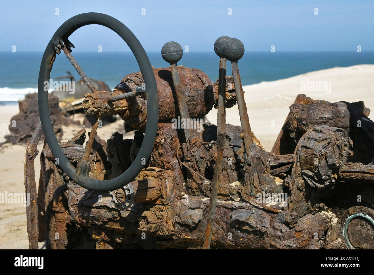 Old strong rusted steering wheel from a track vehicle, diamond prohibited area, Saddlehill, Atlantic Ocean, Namibia, Africa Stock Photo