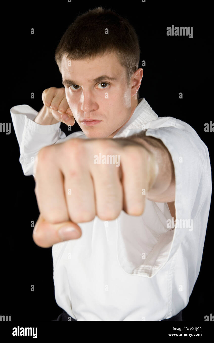 A young man practicing karate Stock Photo - Alamy