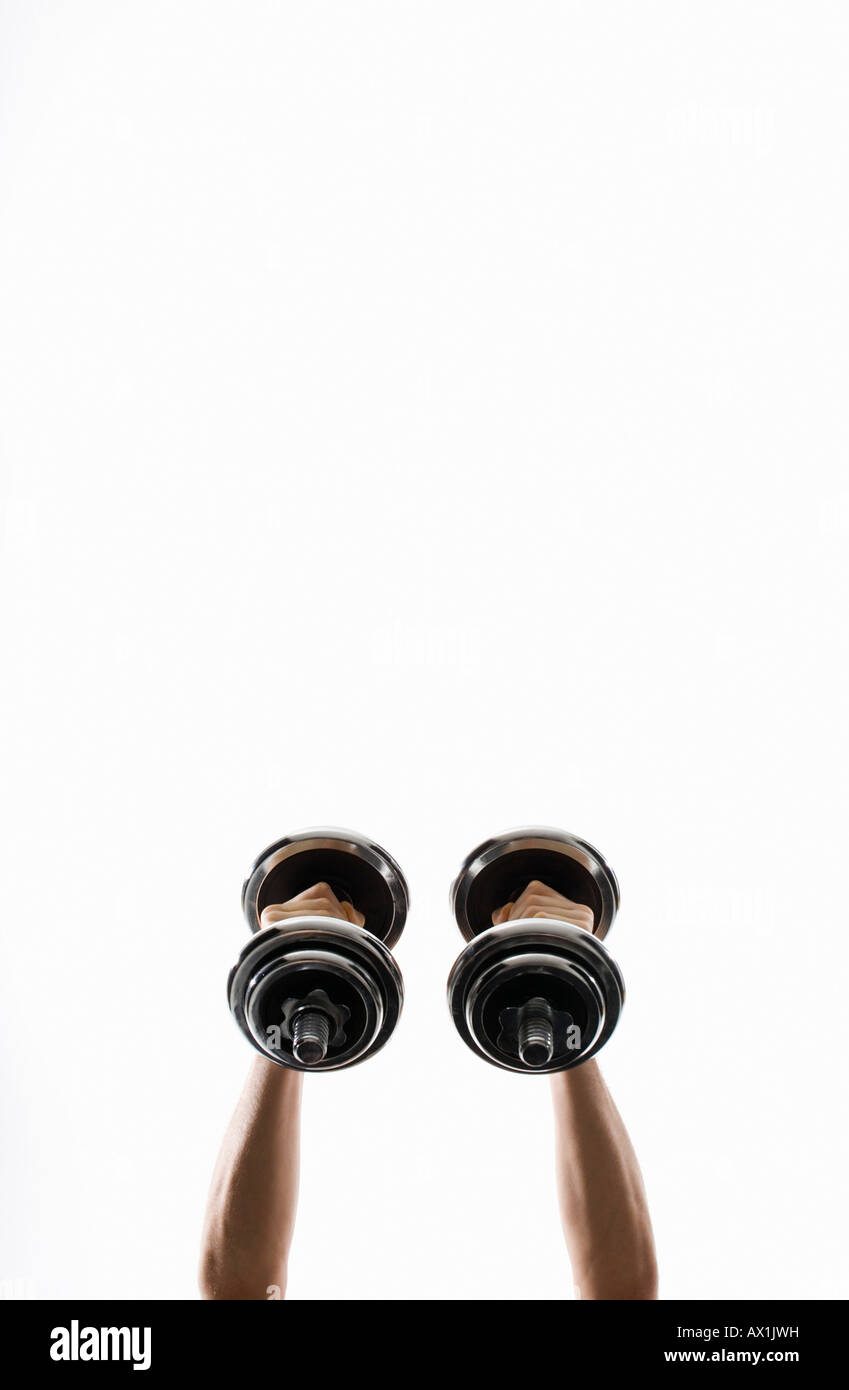 bottom view of human hands lifting two dumbbell weights Stock Photo Alamy