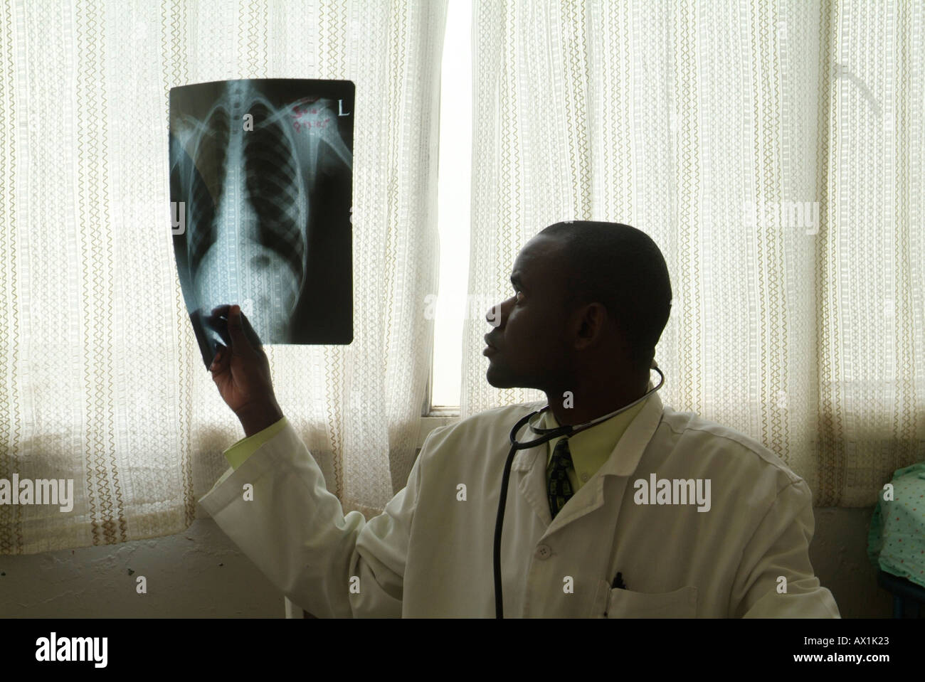 African doctor holding x ray Stock Photo - Alamy