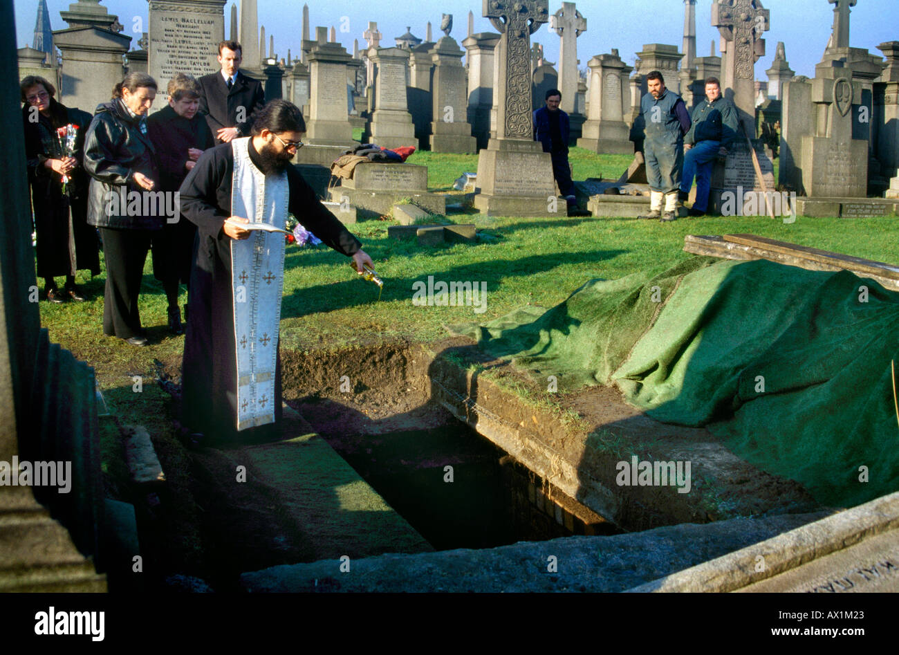 Greek Orthodox Funeral Pouring Olive Oil Into Grave Stock Photo Alamy