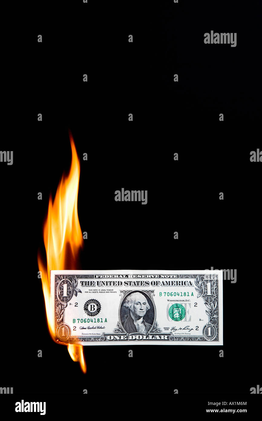 A dollar bill on fire Stock Photo Alamy