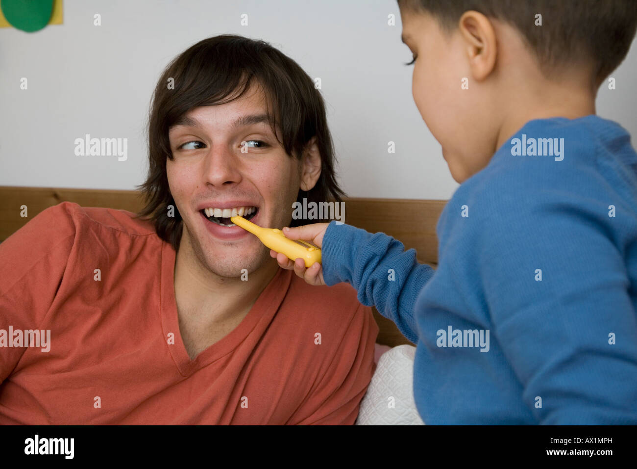 A man and boy playing together Stock Photo Alamy