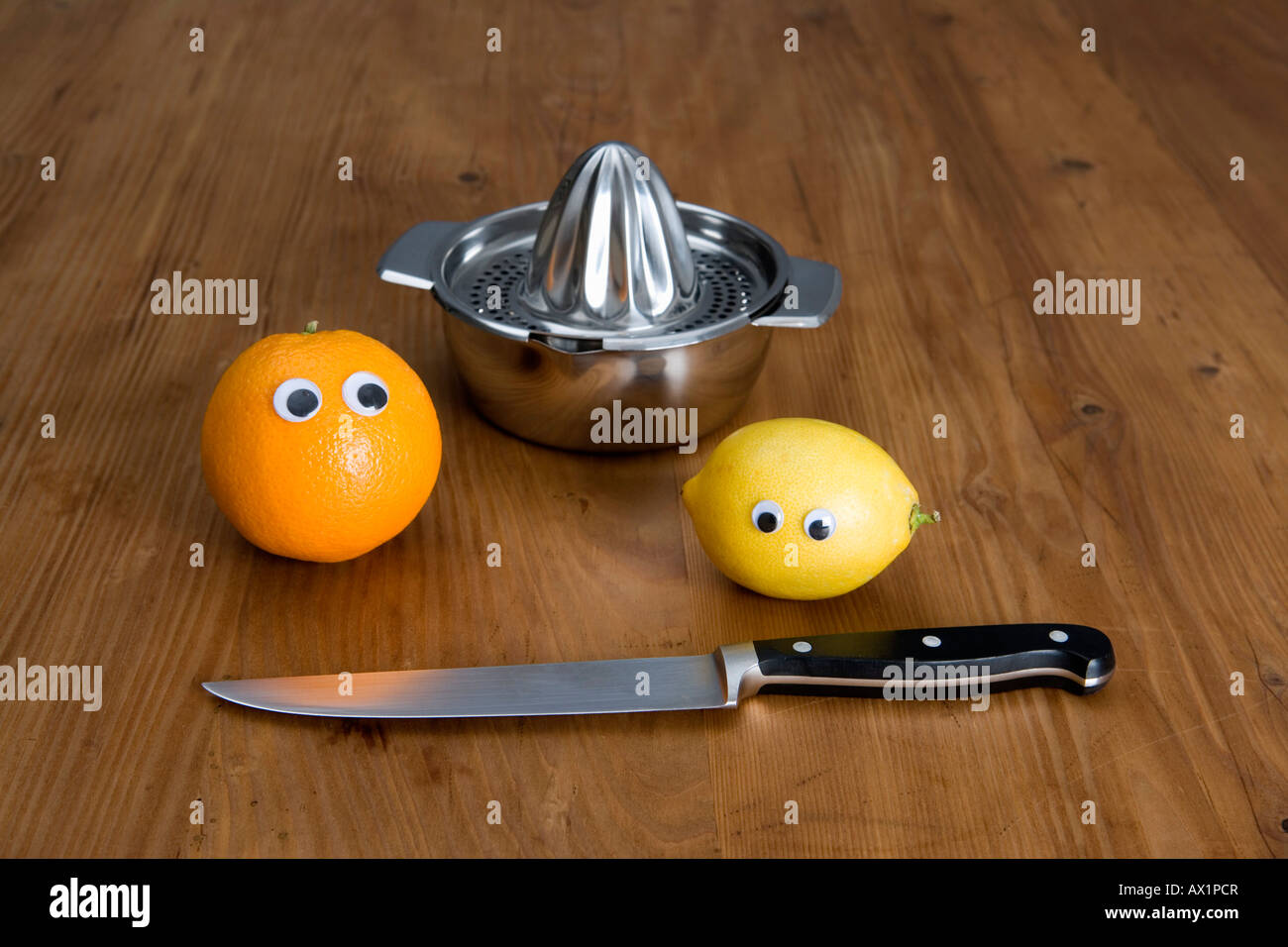 Fruit, a juicer and a kitchen knife Stock Photo Alamy