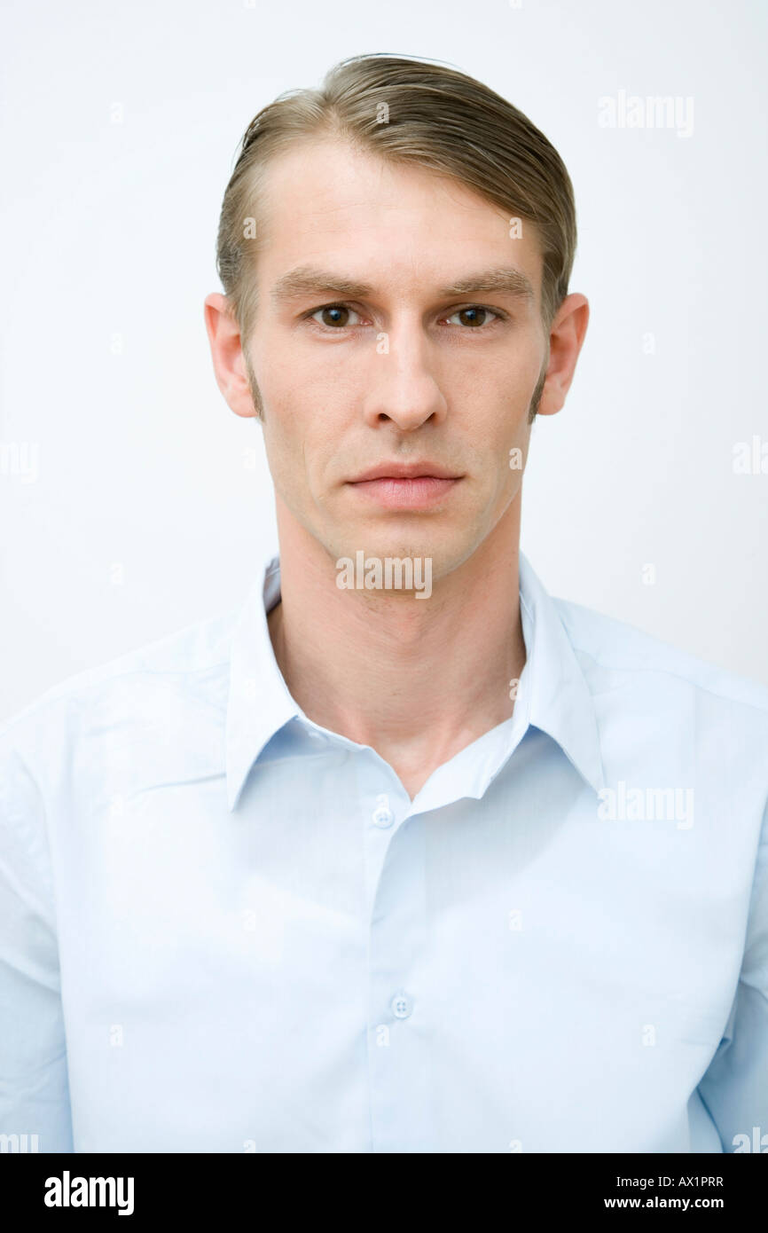Man in a blue shirt hi-res stock photography and images - Alamy