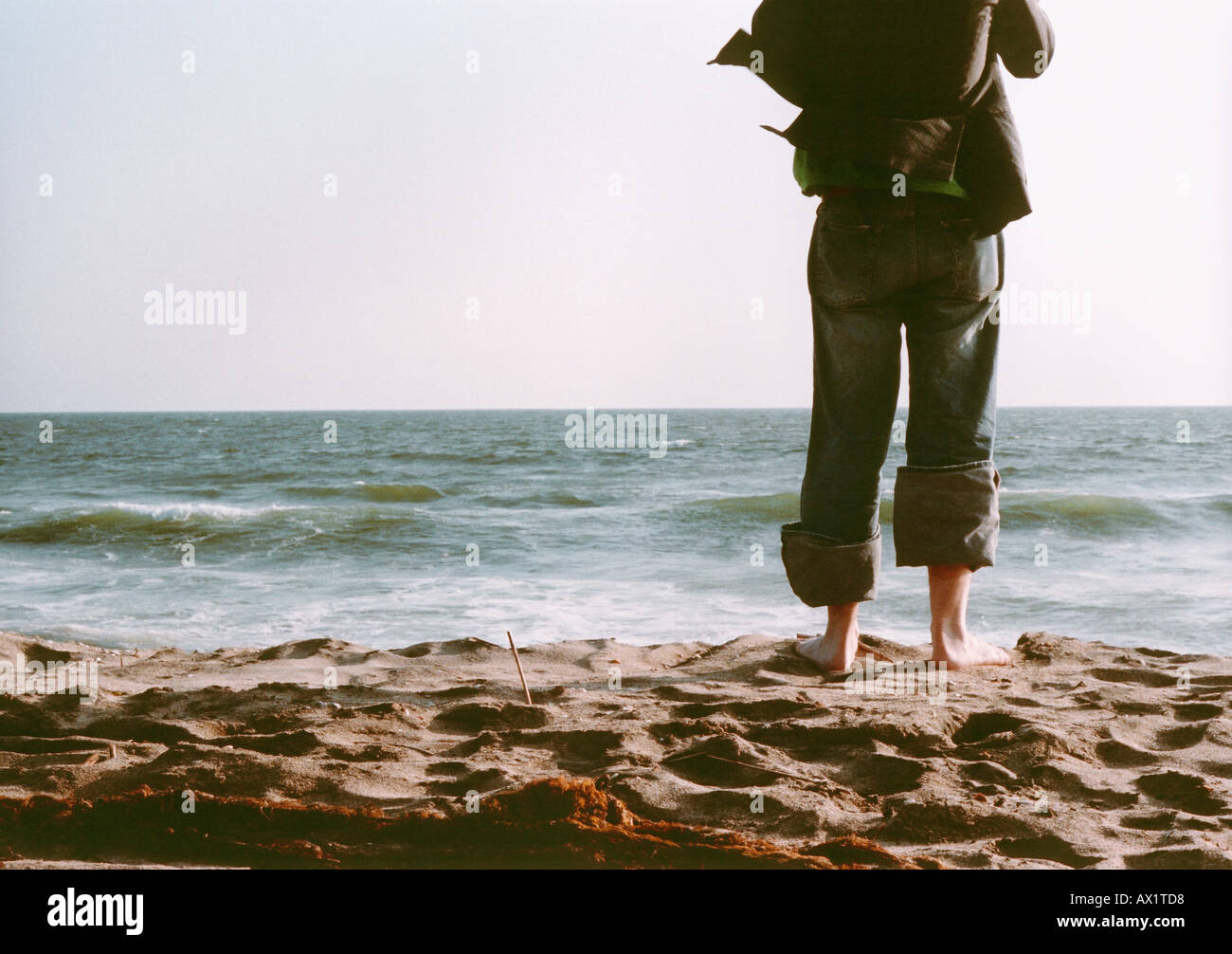 Man standing on beach hi-res stock photography and images - Alamy
