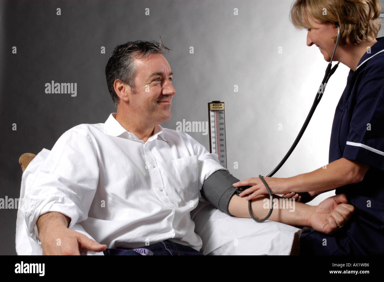 Patients blood pressure being taken Stock Photo Alamy