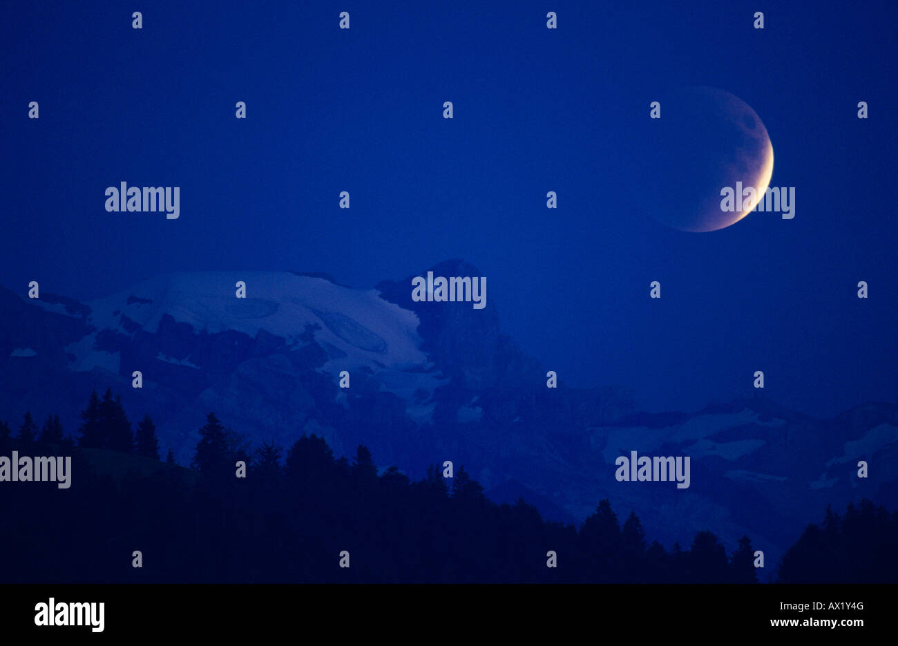 Lunar Eclipse over mountains Zug Switzerland Stock Photo Alamy