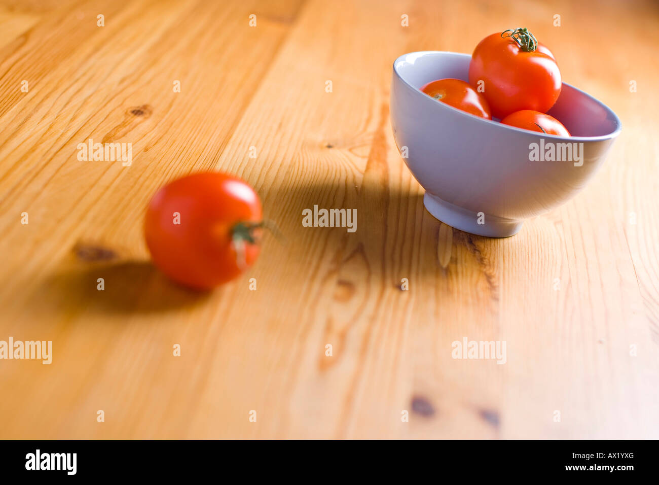 Tomatoes in a bowl Stock Photo