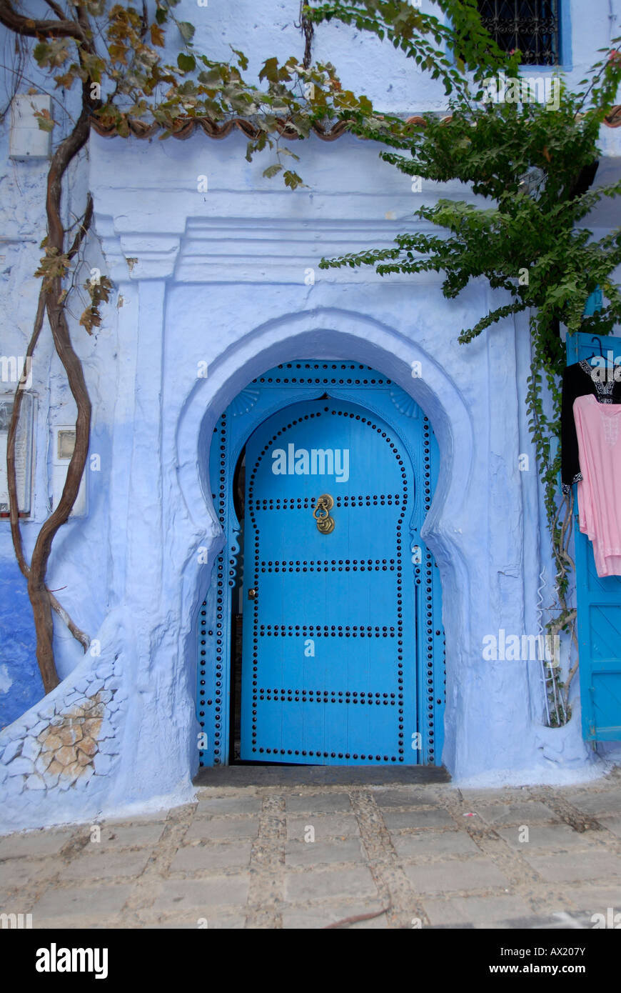 Luminous blue gate medina Chefchaouen Morocco Stock Photo