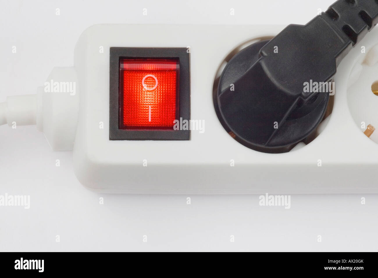 Multiple outlet socket, on/off switch glowing red Stock Photo