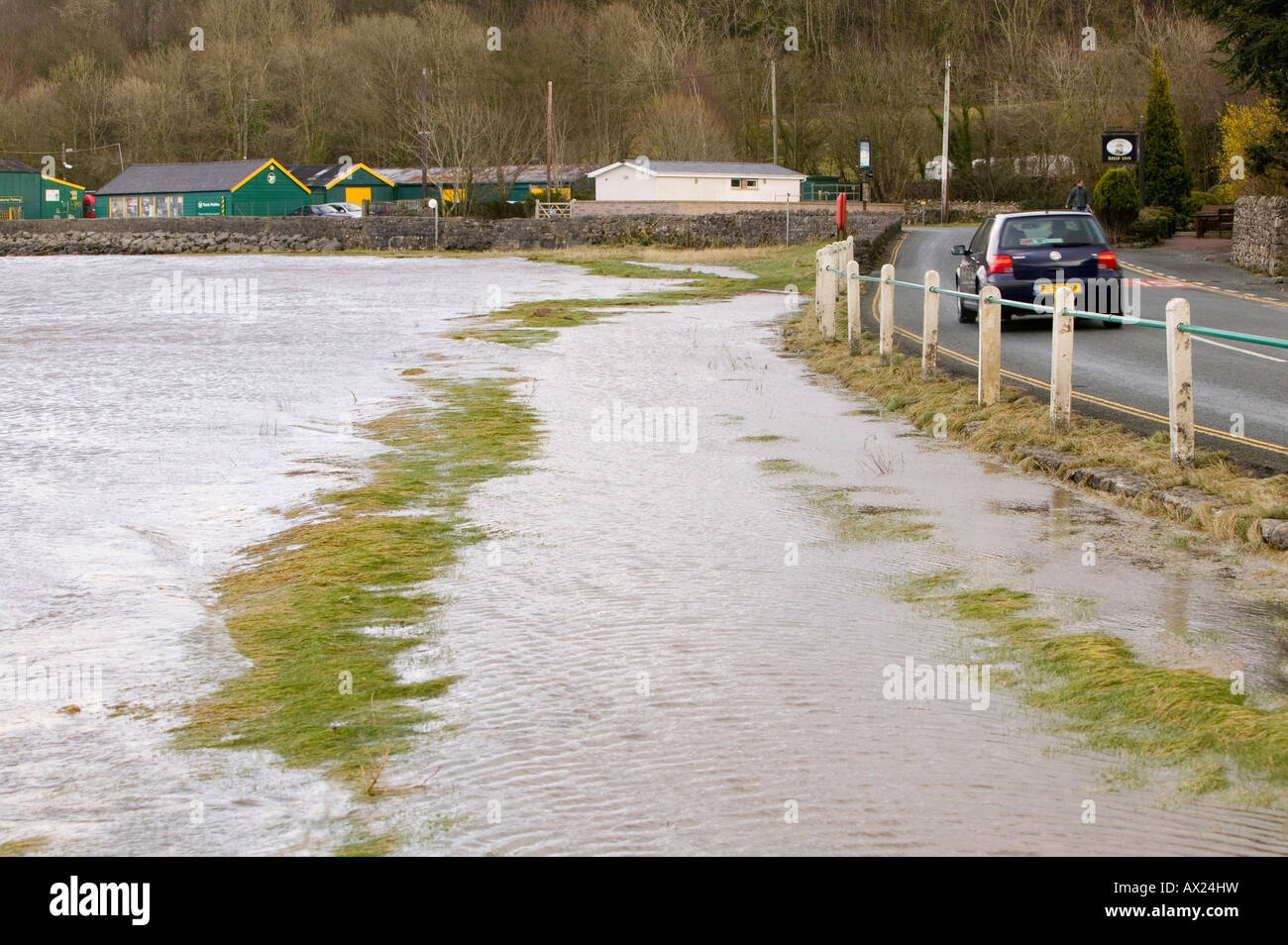Flooding at Sandside near Arnside UK caused by high spring tides and gale force winds pushing the sea over onto the land Stock Photo