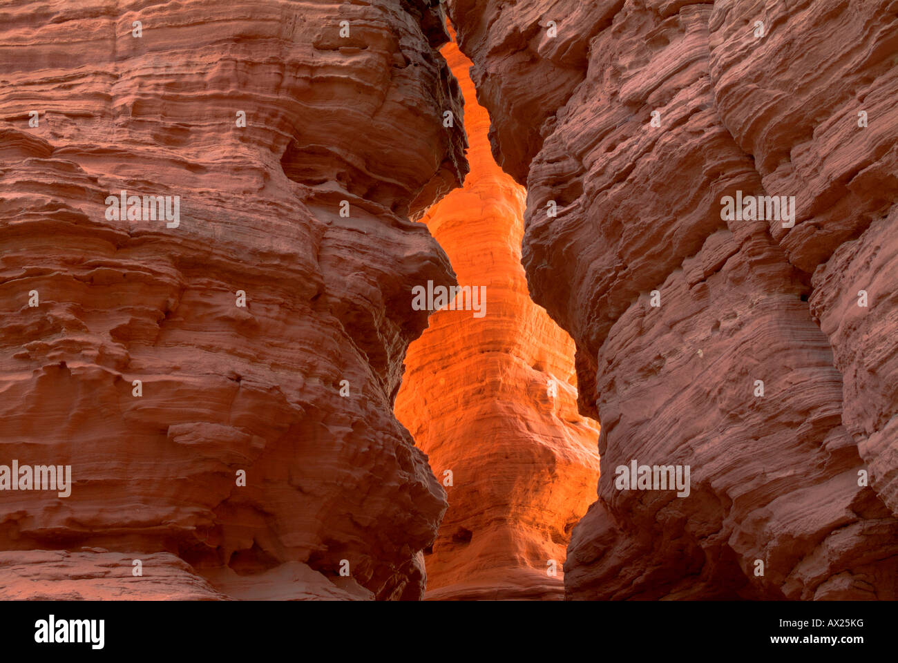 Rocks lit from behind by the setting sun, photographed through a crevasse, Altschlossfelsen rock formations, Pfaelzer Wald (Pal Stock Photo