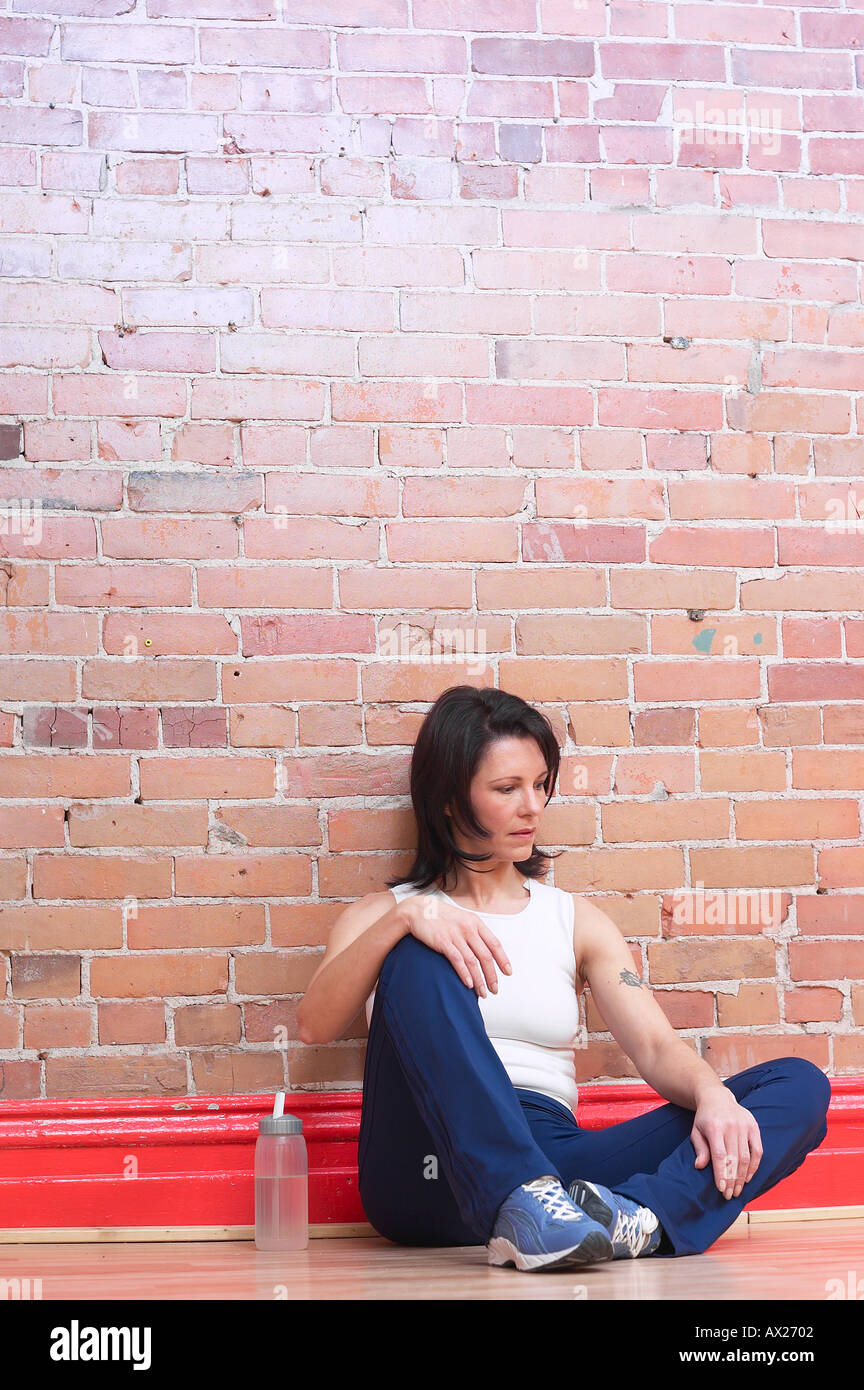 Portrait of an unhappy woman in chains. Crisis and depression. Stock Photo