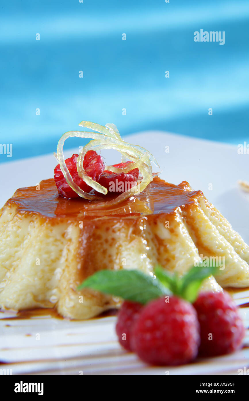 Caramel custard with red fruits Stock Photo Alamy