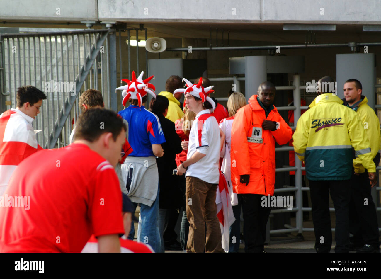 England fans queue at a turnstile at the city of manchester stadium ...